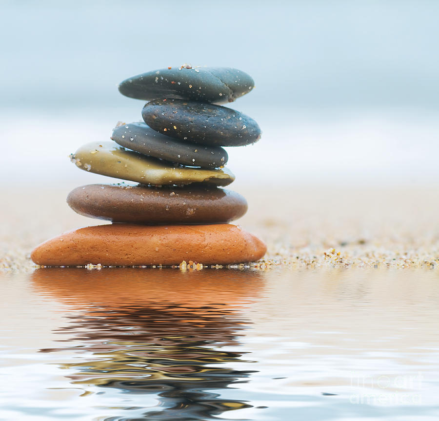 Summer Photograph - Stack of beach stones on sand #2 by Michal Bednarek