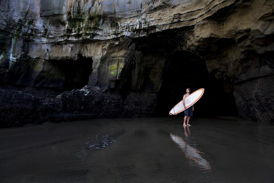 Sports Photograph - Surfer Inside A Cave At Muriwai, New #2 by Deddeda