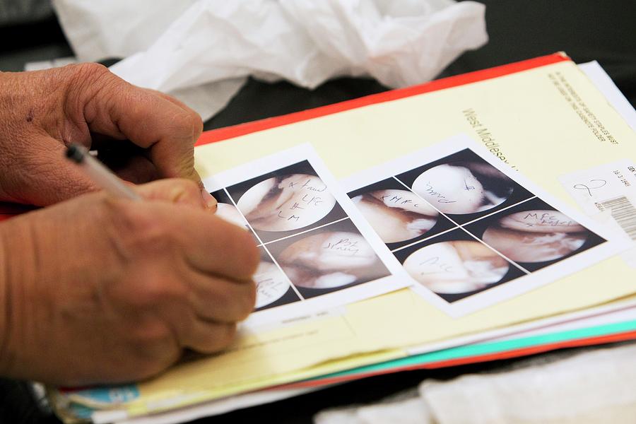 Surgeon Writing Notes #2 Photograph by Mark Thomas/science Photo Library