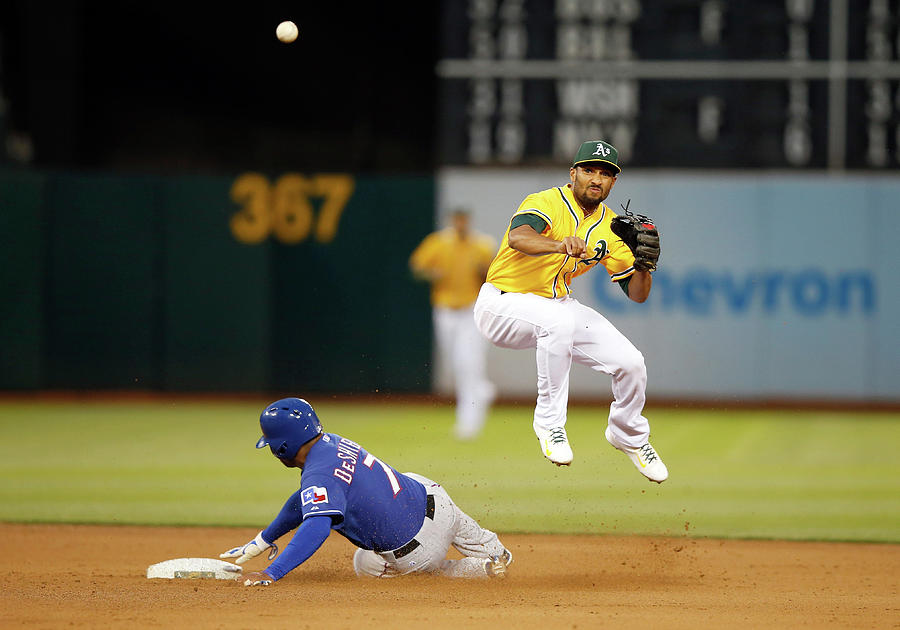 Texas Rangers V Oakland Athletics Photograph by Ezra Shaw Texas Rangers V Oakland Athletics Photograph by Ezra Shaw