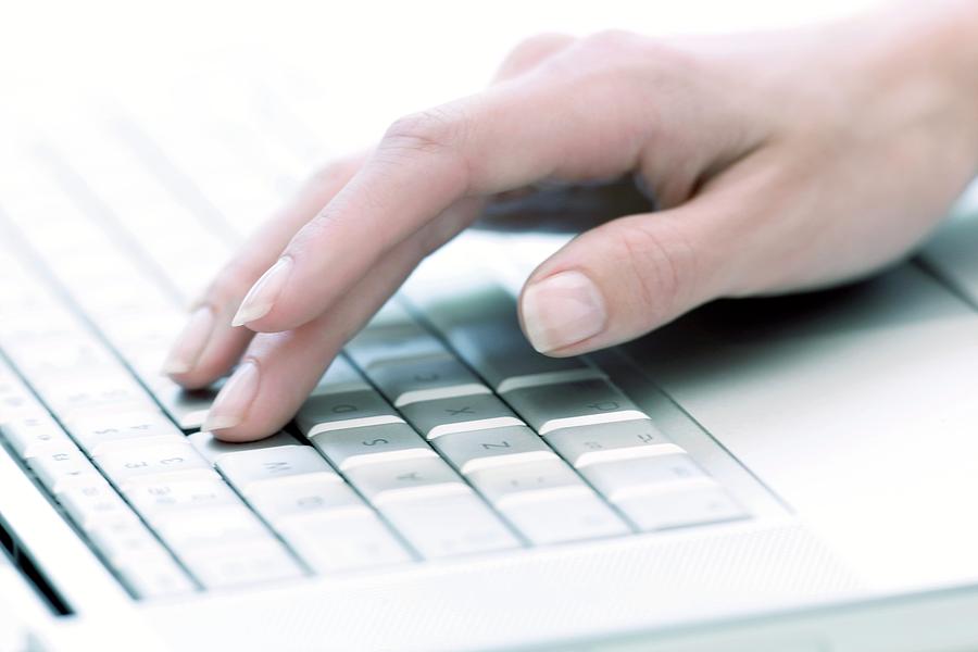 Typing On A Laptop #2 Photograph by Ian Hooton/science Photo Library