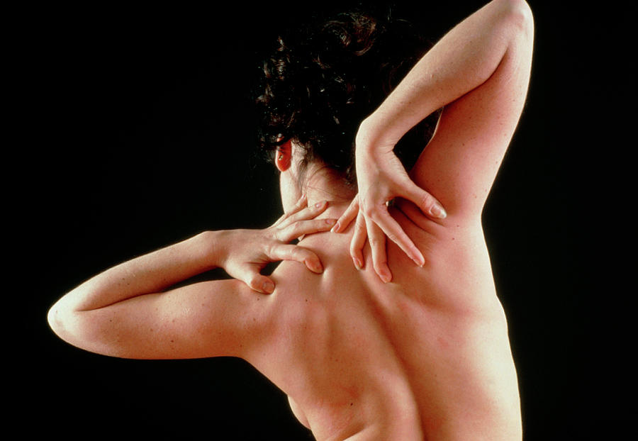 Woman Affected By Shoulder Pain Doing Self-massage #2 Photograph by Seth Joel/science Photo Library