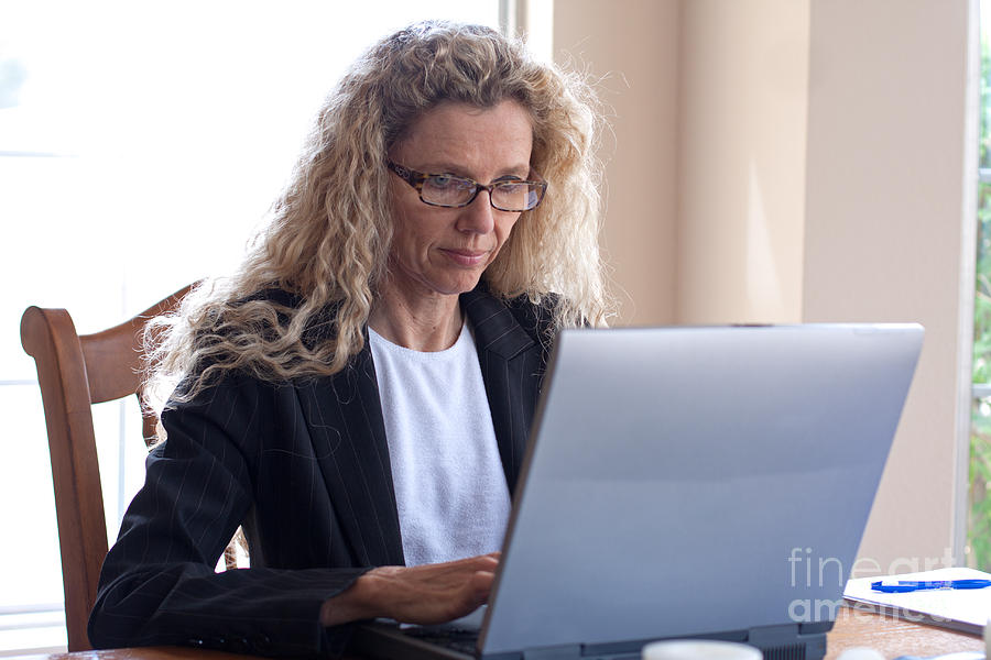 Portrait Photograph - Woman on table with laptop #2 by Gunter Nezhoda