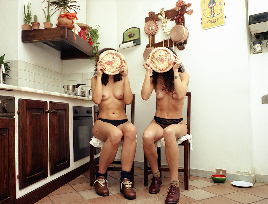 2 Women Hiding Behind Pizzas Photograph by Emma Innocenti