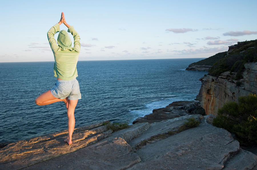 Australia Photograph - Yoga On Rocky Outcrop Above Ocean #2 by Lars Schneider
