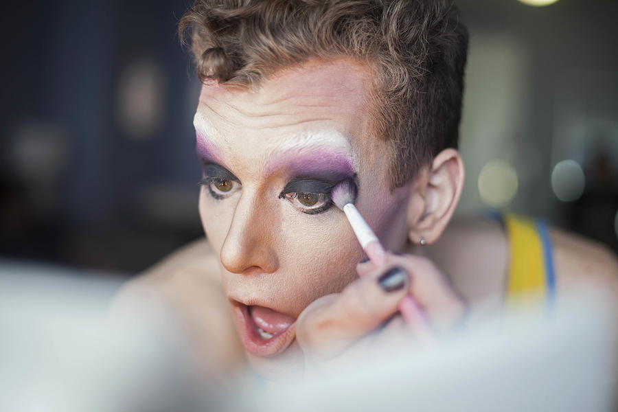 Young man applying drag makeup #2 Photograph by Hex