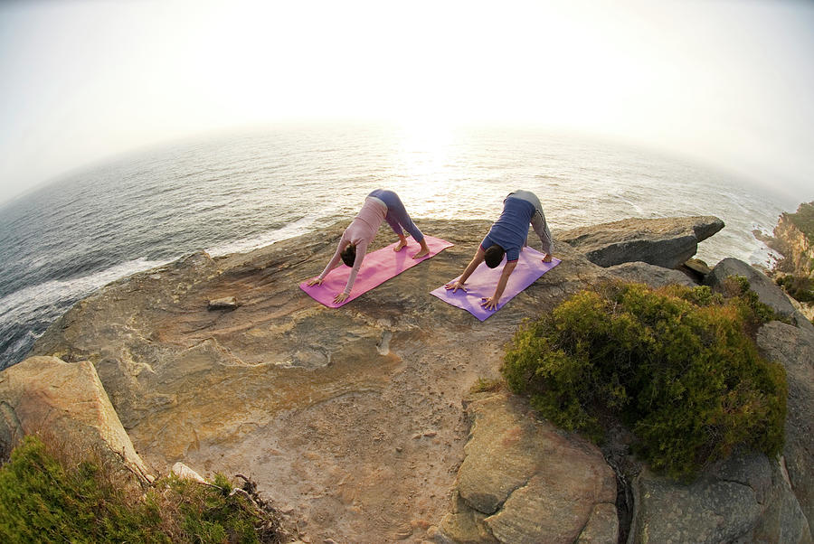 Australia Photograph - A Man And Woman Practicing Yoga #21 by Lars Schneider
