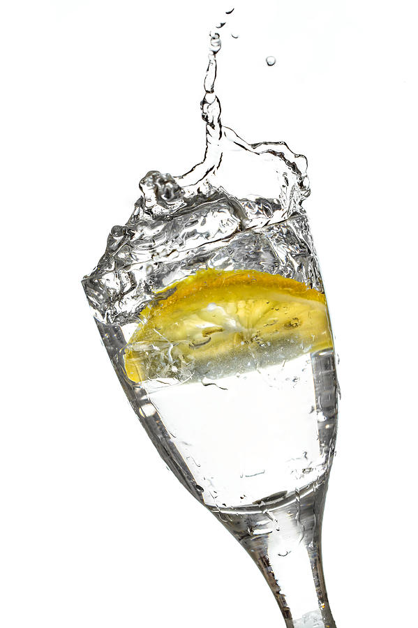 Slice of lemon in Glass #24 Photograph by Peter Lakomy