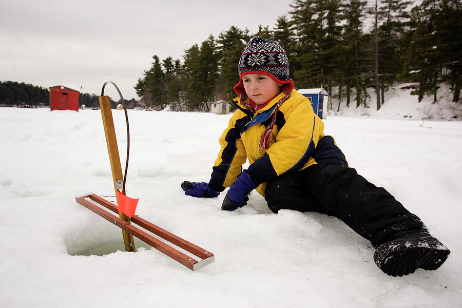A Boy Checks Traps, While Ice Fishing #3 Photograph by Carl D