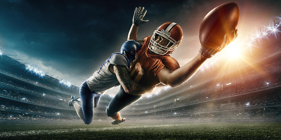 American football player being tackled #3 Photograph by Dmytro Aksonov