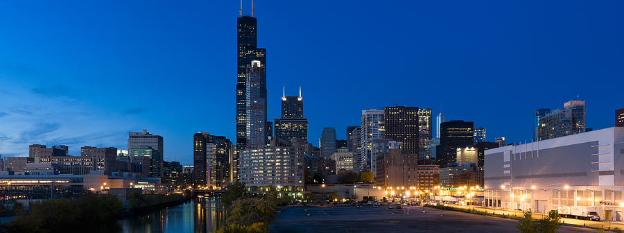 Buildings In A City Lit Up At Dusk #3 Photograph by Panoramic Images