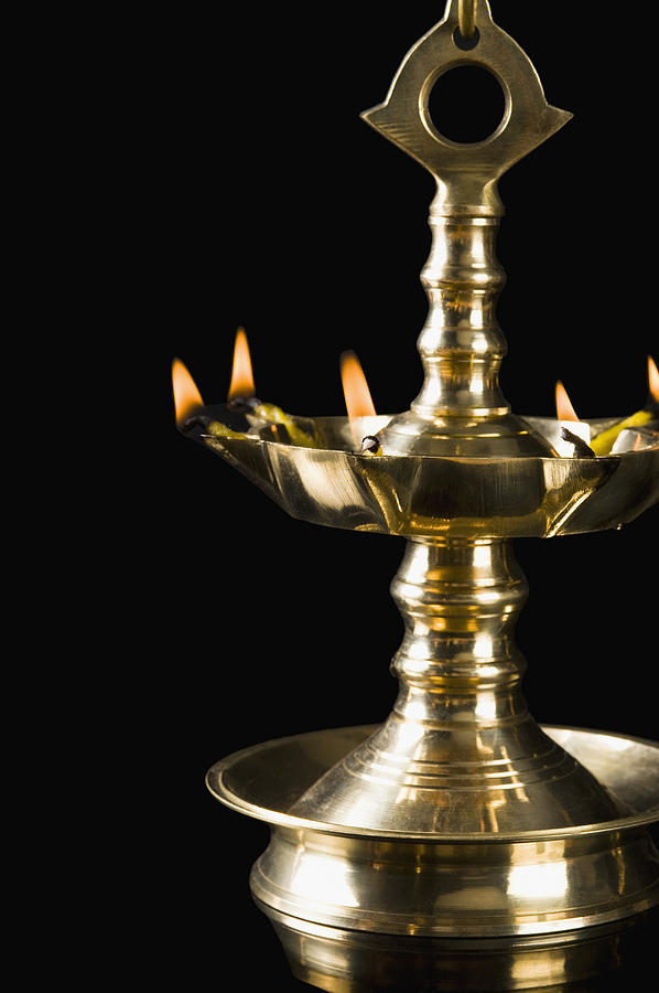 Close-up of a Diwali oil lamp #3 Photograph by Photosindia