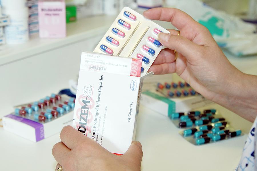 dispensing-medications-photograph-by-life-in-view-science-photo-library