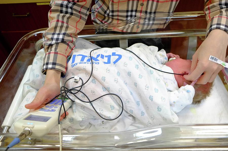 Doctor Examines A Newborn #3 Photograph by Photostock-israel