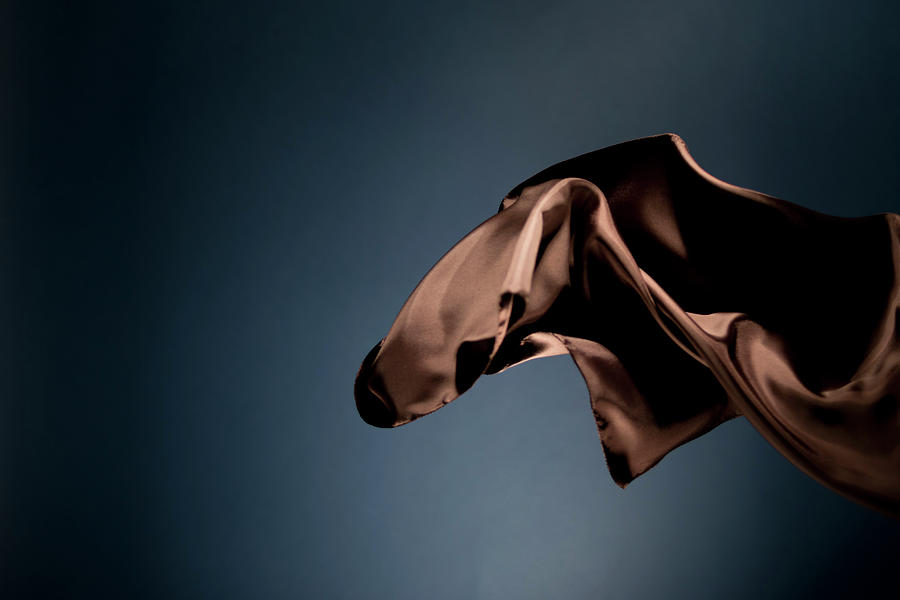 Floating Brown Satin On A Dark Blue #3 Photograph by Gm Stock Films