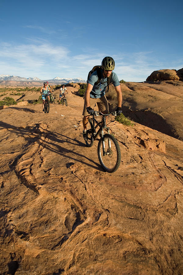 Nature Photograph - Group Mountain Biking, Moab, Utah #3 by Whit Richardson