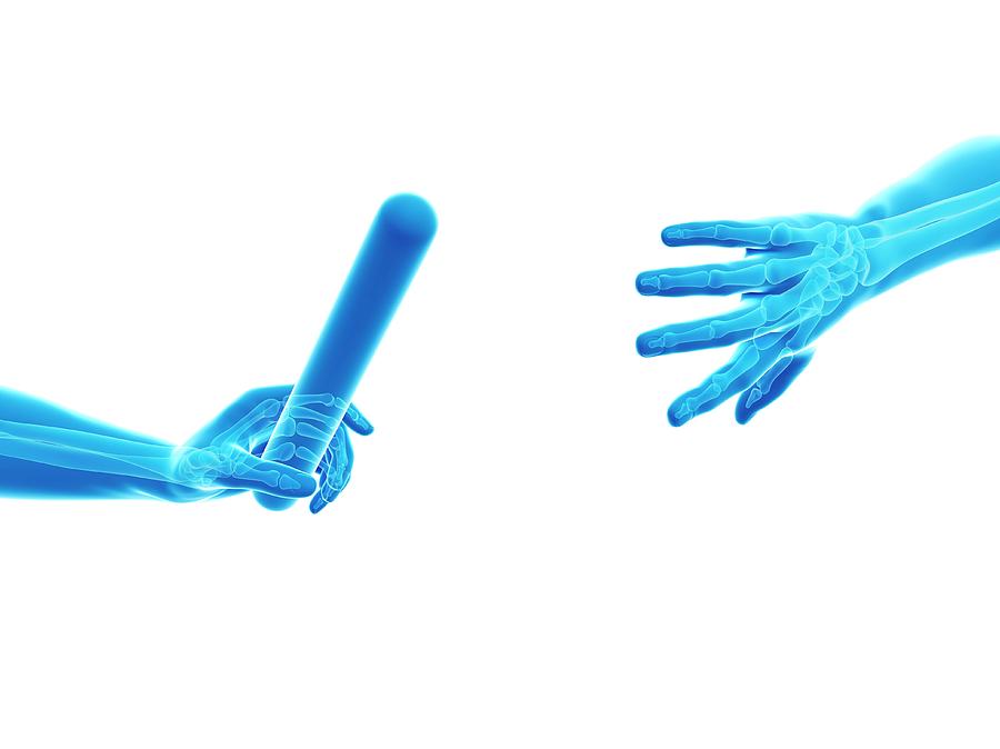 Human Hand Passing Relay Baton #3 Photograph by Sebastian Kaulitzki