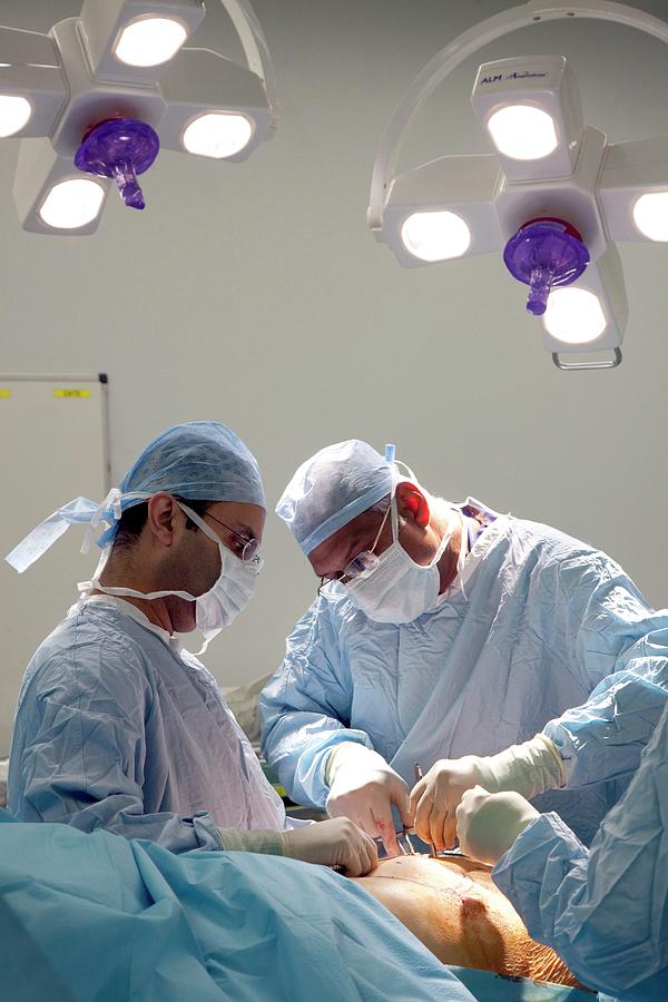 an-ad-for-the-medical-center-with-two-doctors-in-scrubs-and-surgical