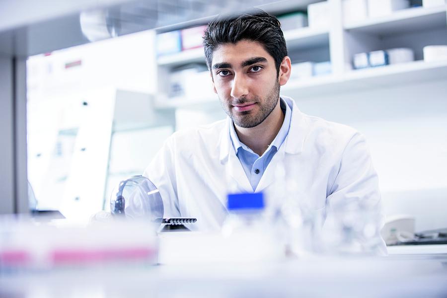 Lab Assistant Using Mini Centrifuge #3 by Science Photo Library