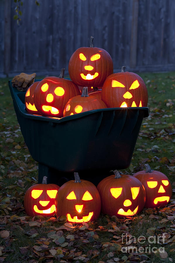 Lit Carved Pumpkins In A Wheel Barrow #5 Photograph by Jim Corwin