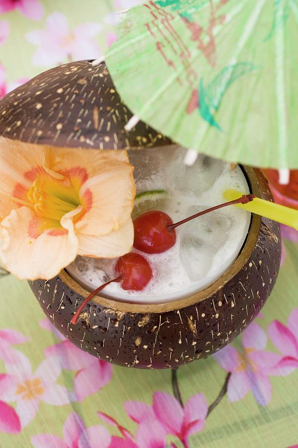 Pina Colada With Flower And Cherries Photograph by Foodcollection ...