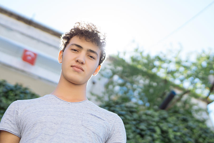 Portrait of Handsome teen boy outdoors #3 Photograph by Burak Karademir