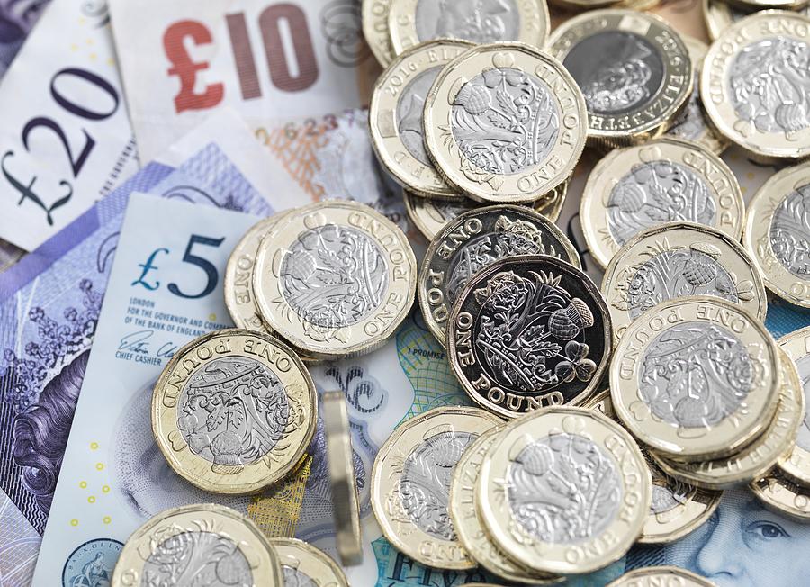 Pound coins and bank notes Photograph by Tek Image/science Photo Library