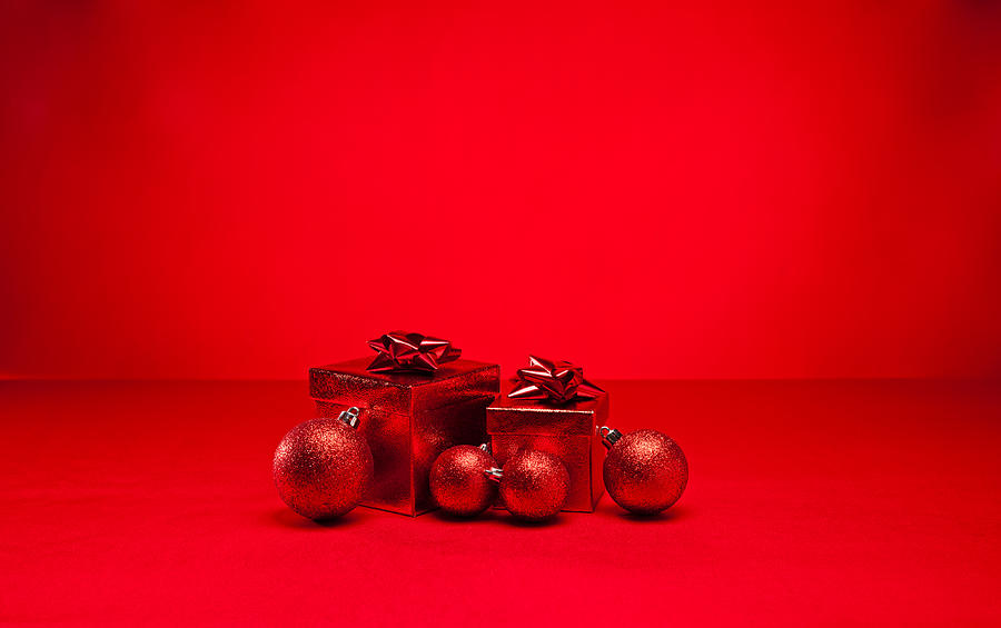 Red bauble and Christmas present #3 Photograph by U Schade