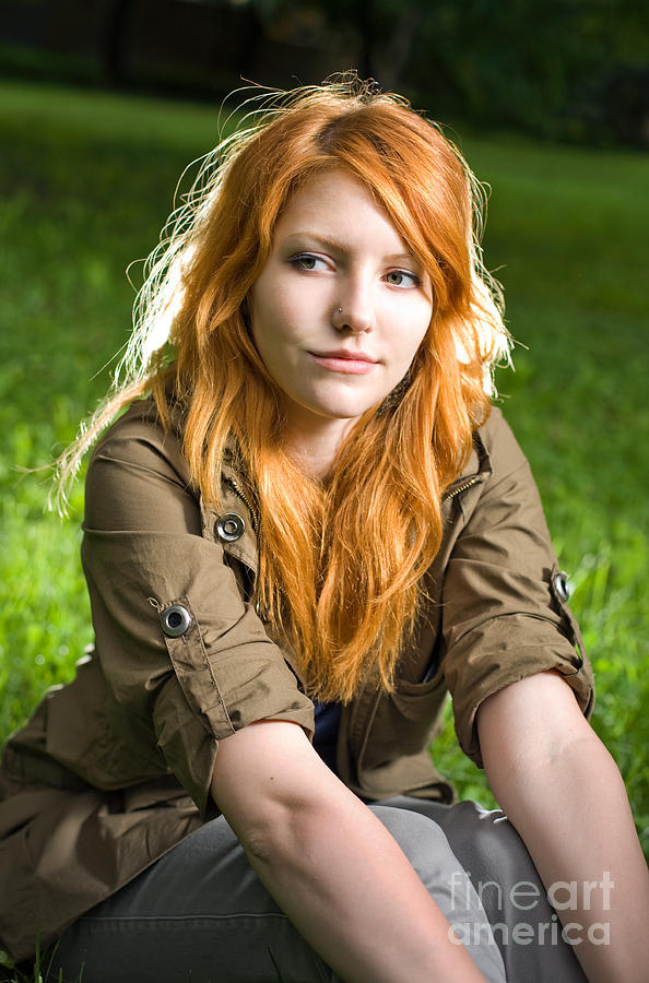 Romantic Portrait Of A Young Redhead Girl Sitting In The Park 9814