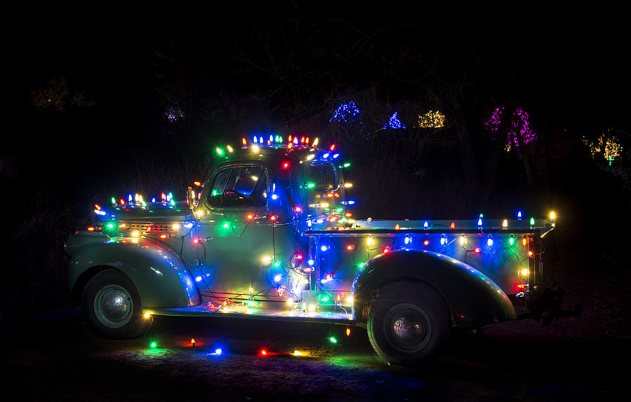 Christmas Photograph - Antique Pickup Truck Decorated for Christmas by John Bielick