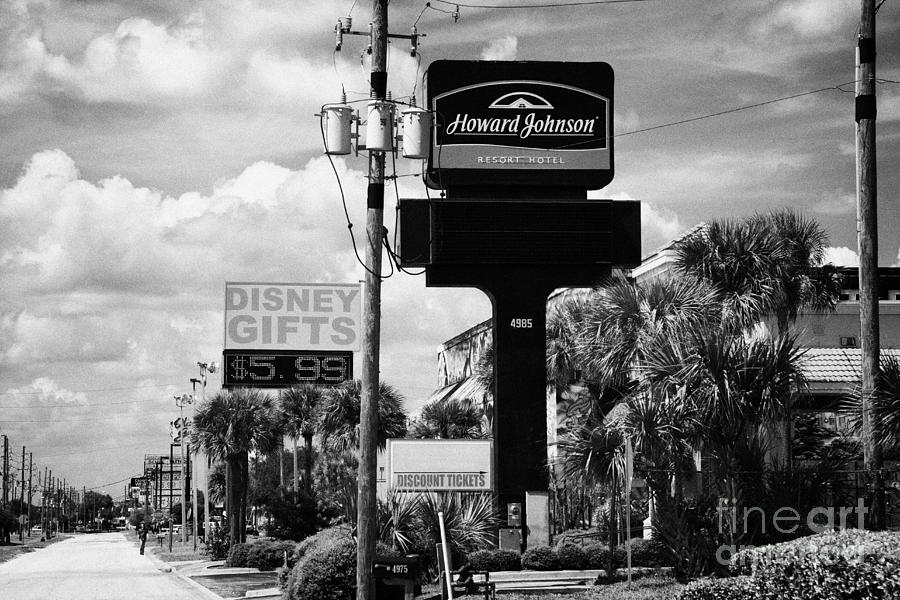 Sign Photograph - Signs For Gift Shops Hotels Restaurants And Shopping On Highway 192 Kissimmee Florida Usa #3 by Joe Fox
