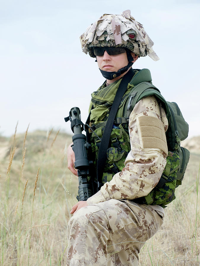 Soldier In Desert Uniform Holding #3 Photograph by Oleg Zabielin