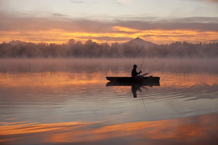 Sunrise in fog Lake Cassidy with fisherman in small fishing boat #4 Photograph by Jim Corwin