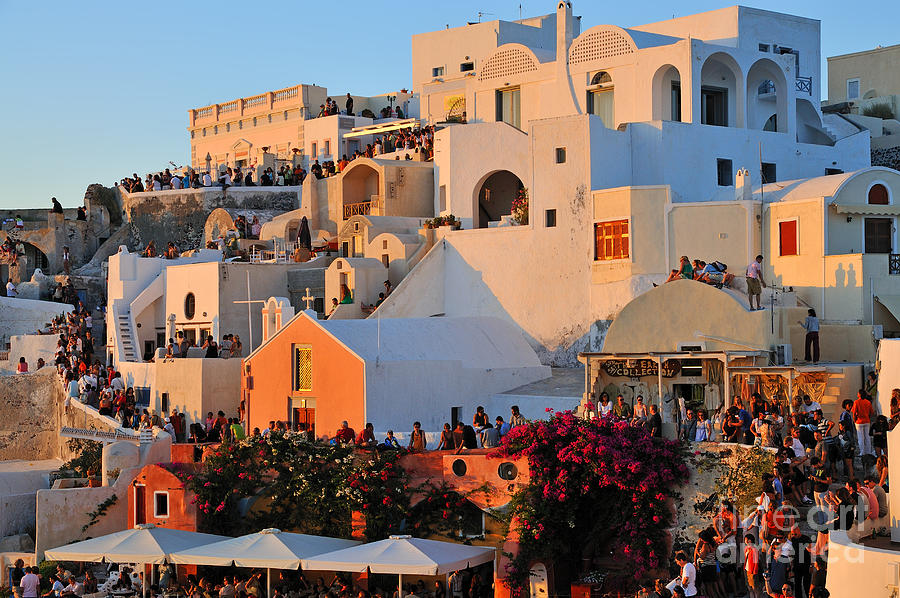 Waiting for the sunset in Oia town Photograph by George Atsametakis