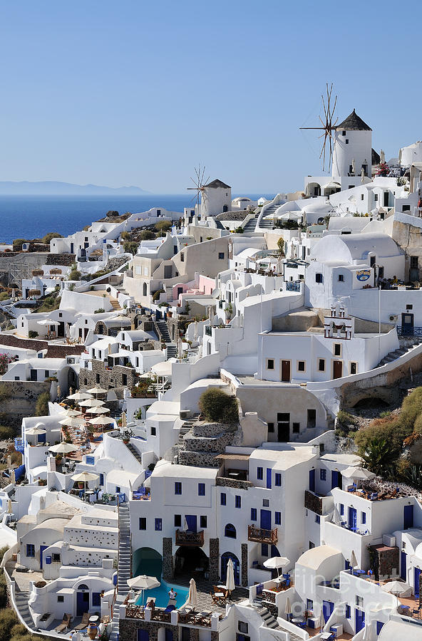 Greek Photograph - Windmills and white houses in Oia by George Atsametakis