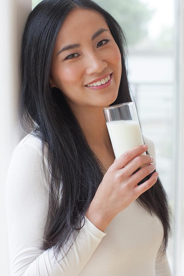 Woman Holding Glass Of Milk Photograph By Ian Hooton Fine Art America