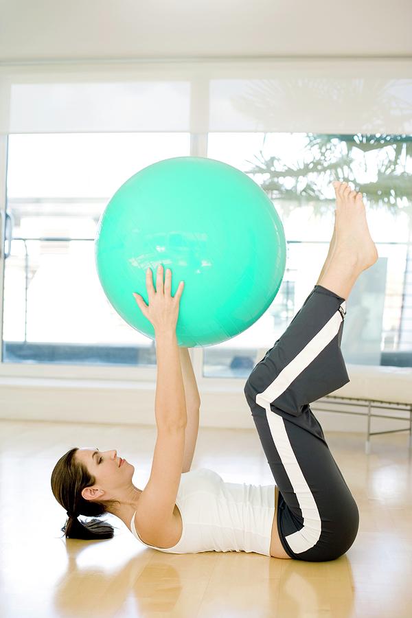 Woman Using Exercise Ball #3 Photograph by Ian Hooton/science Photo Library