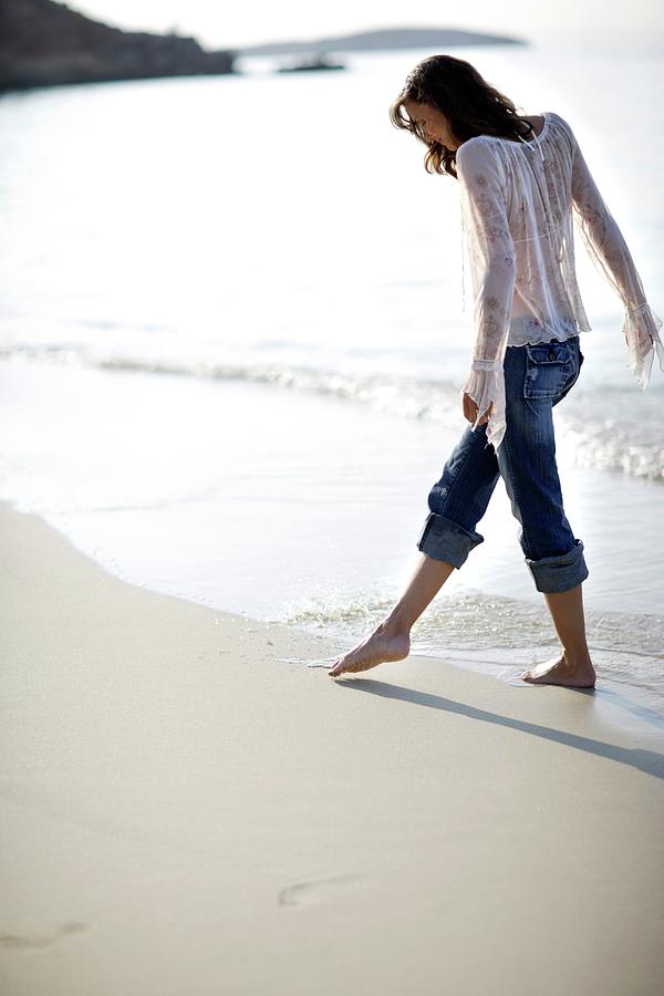 Woman Walking Along A Beach #3 Photograph by Science Photo Library Woman Walking Along A Beach #3 Photograph by Science Photo Library