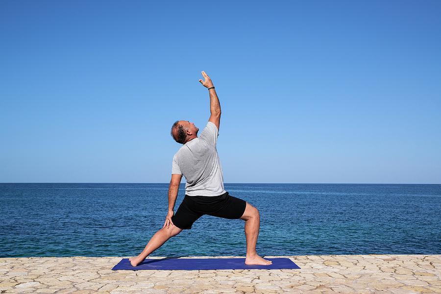 Yoga By The Sea #3 Photograph by John Greim/science Photo Library