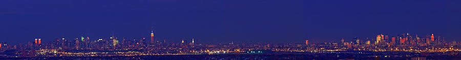 Buildings In A City Lit Up At Night #4 Photograph by Panoramic Images