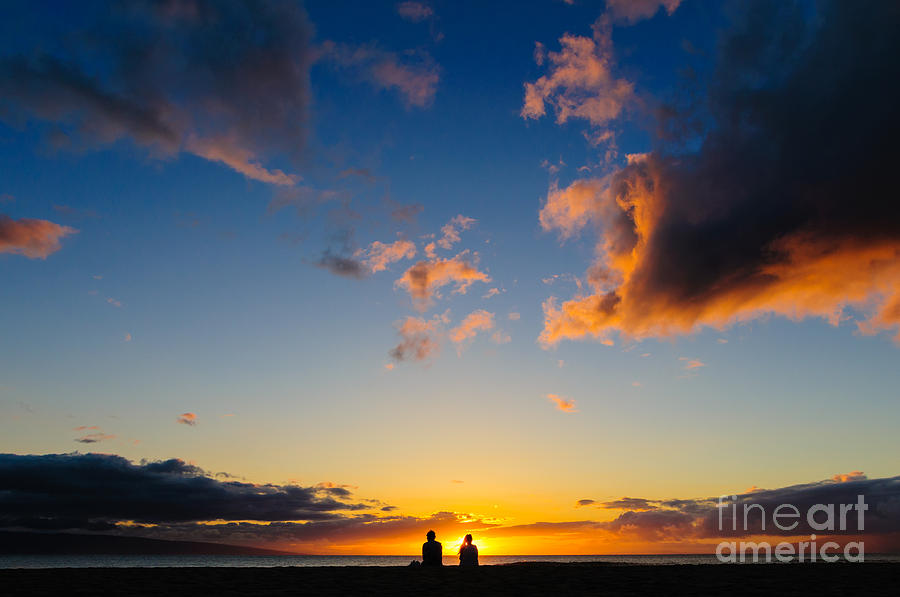 Couple watching the sunset on a beach in Maui Hawaii USA #4 Photograph by Don Landwehrle