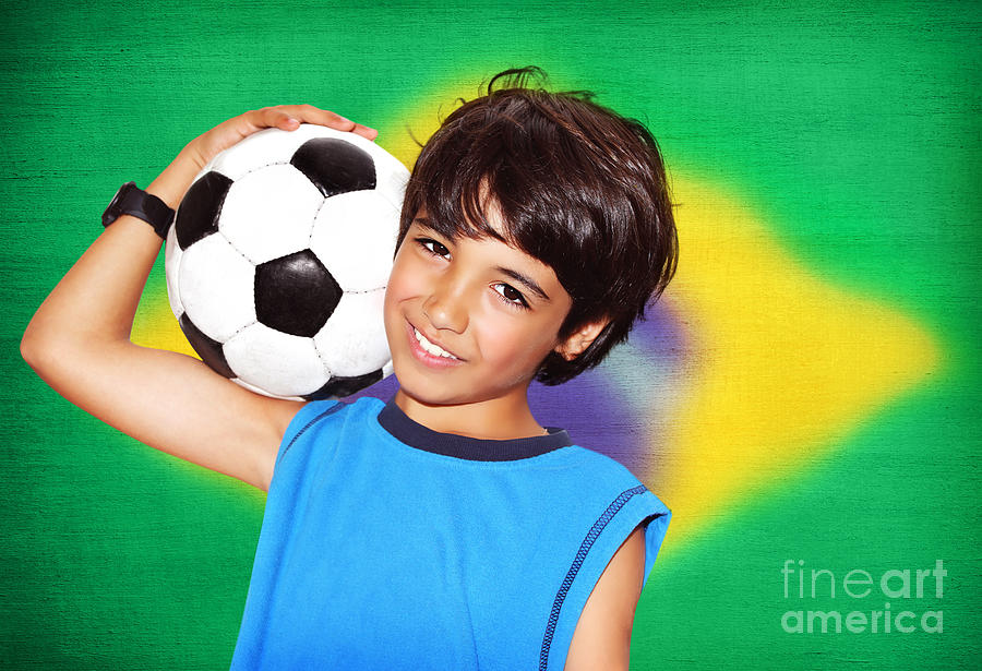 Portrait of cute little boy in sportswear with a soccer ball