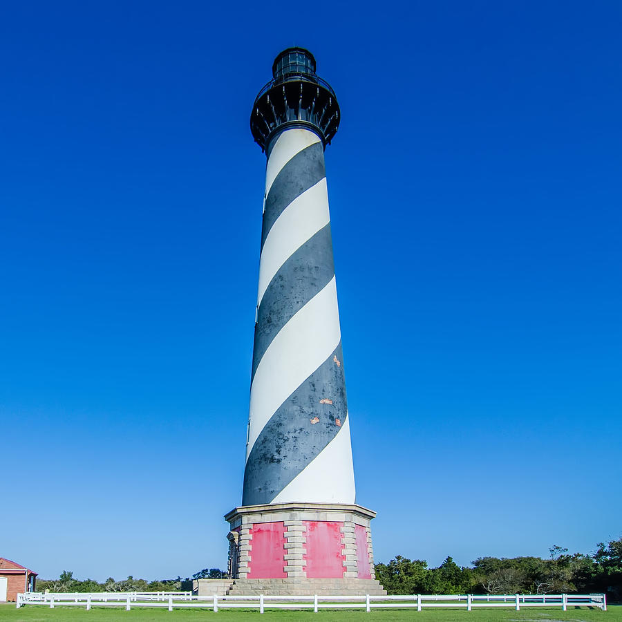 Diagonal black and white stripes mark the Cape Hatteras lighthou #4 Photograph by Alex Grichenko