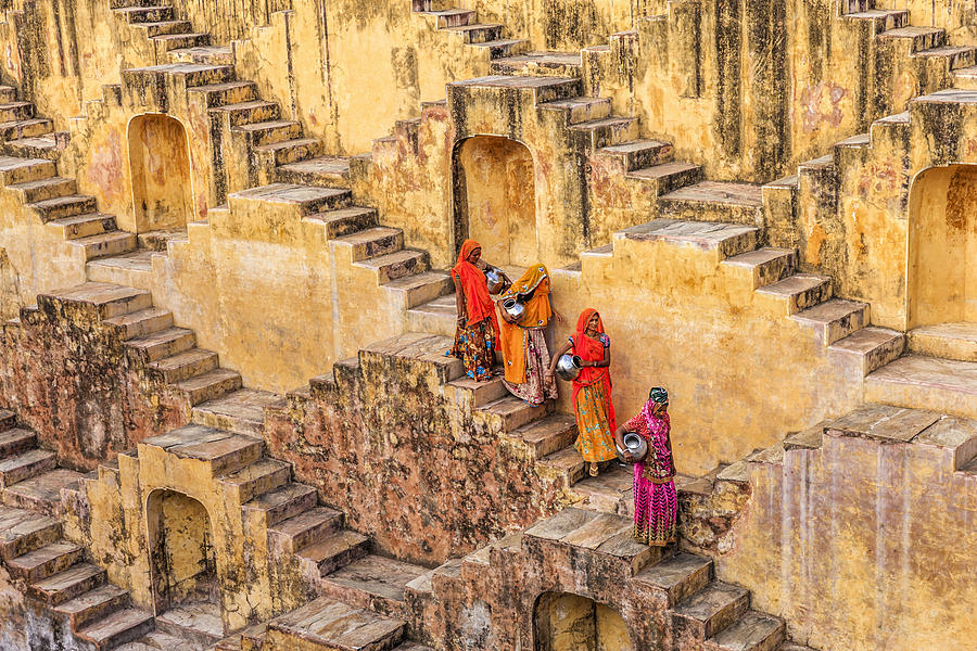Indian women carrying water from stepwell near Jaipur #4 Photograph by Hadynyah