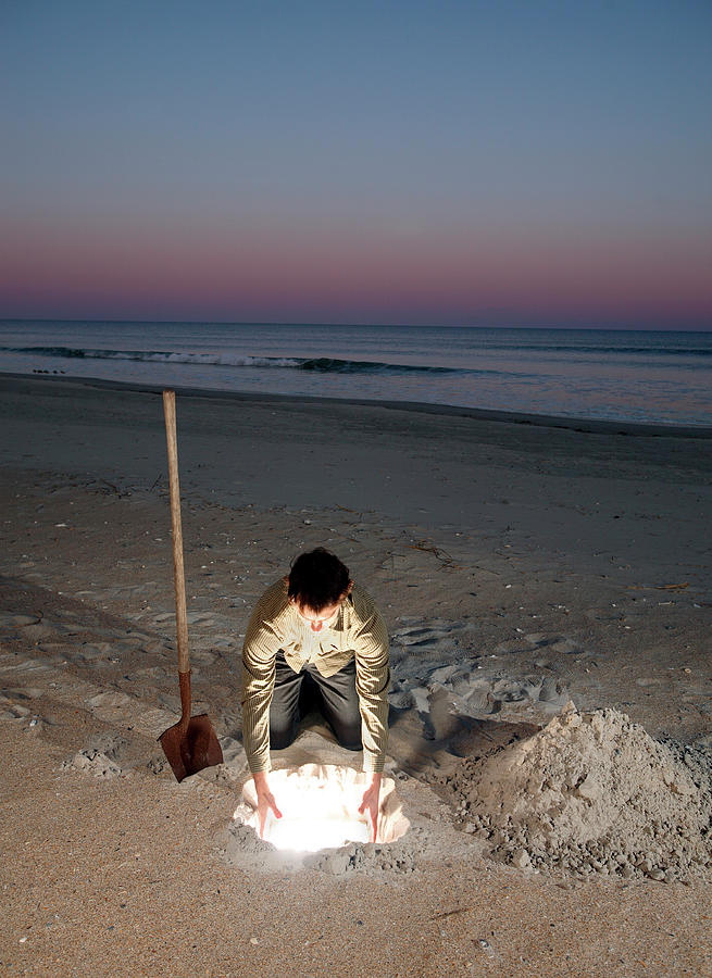 Sunset Photograph - Man Leans Over Glowing Hole In Ground #4 by Logan Mock-Bunting