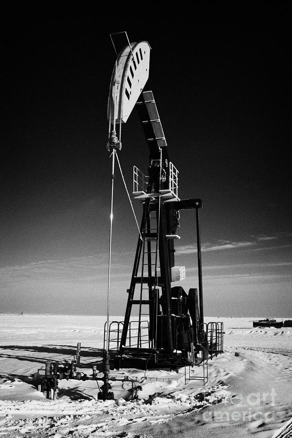 Winter Photograph - oil pumpjack in winter snow Forget Saskatchewan Canada #4 by Joe Fox