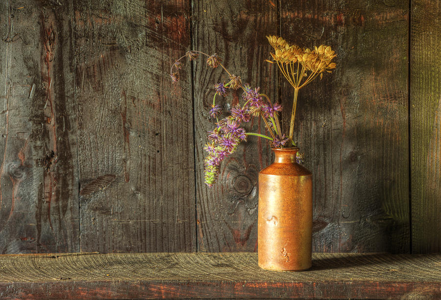 Flower Photograph - Retro style still life of dried flowers in vase against worn woo #4 by Matthew Gibson