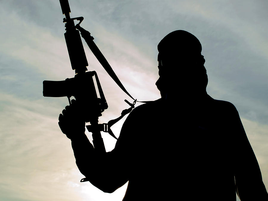 Silhouette Of Soldier With Rifle #4 Photograph by Oleg Zabielin