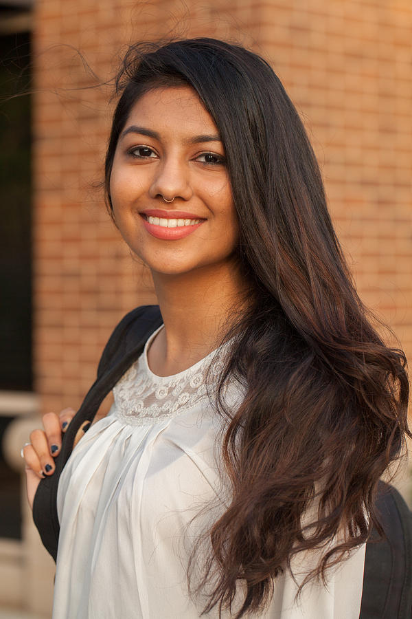 Smiling female young college student of Indian ethnicity #4 Photograph by XiFotos