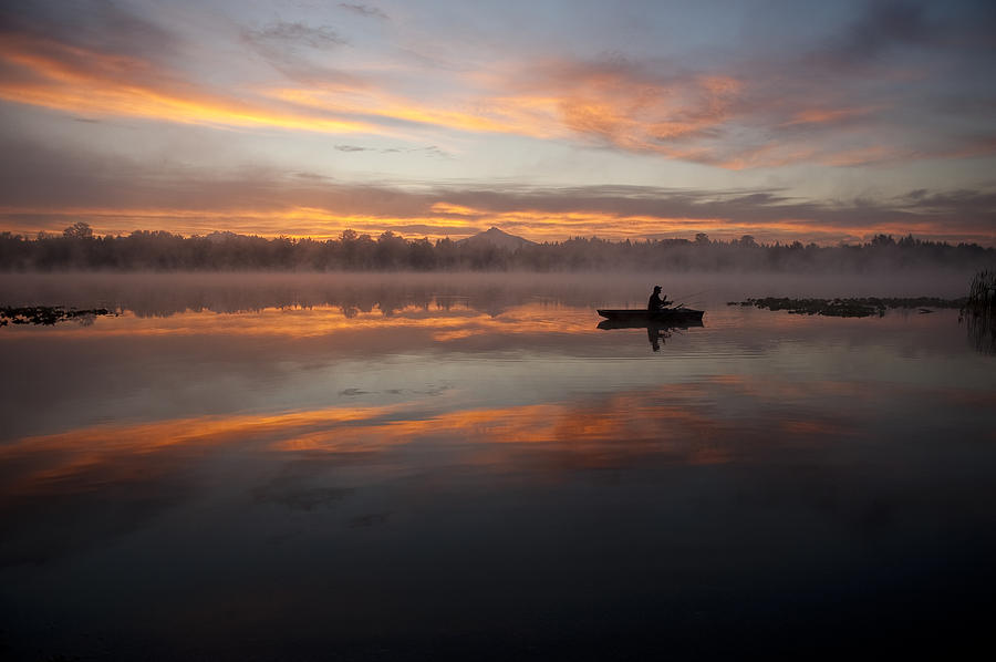 Sunrise in fog Lake Cassidy with fisherman in small fishing boat #5 Photograph by Jim Corwin